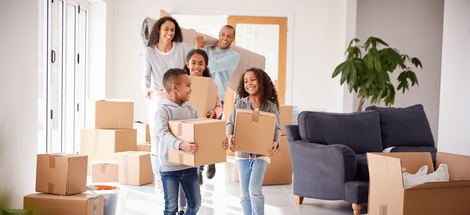 Happy family moving in to their new home thanks to Noreast Mortgage Services